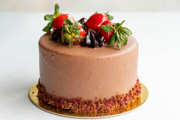 Strawberry and chocolate cake on a white background. Horizontal view. Close-up celebration cake
