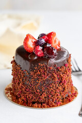 Forest fruit cake on a white background. Vertical view. Close-up celebration cake. Story format