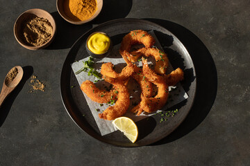 Dish of battered prawns with spices