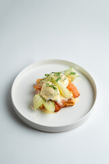 Salmon and poached egg waffle with hollandaise sauce, top view on white dish, menu design