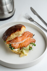 Smoked salmon bagel with lettuce and cream cheese, white modern new york coffee house