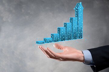 Business man holding 3D graphs low polygonal and stock market statistics gain profits. Concept of growth planning,business strategy.economic growing concept.Business strategy. Digital marketing.