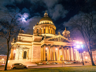 Fototapeta na wymiar Saint Petersburg architecture. Russia landmarks. Isaac's cathedral night. St. Isaac's Square in winter evening. Winter Saint Petersburg without snow. Automobile road Petersburg. Architecture Russia
