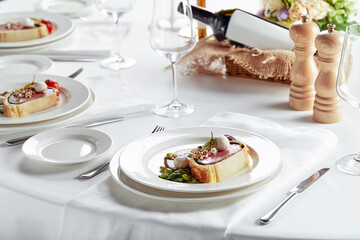 Meat roll sliced on a dish with vegetables on a festive table