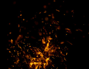 Fototapeta na wymiar flame fire with sparks on black background