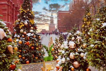 Moscow New Year. Russia Christmas. Red Square with Christmas decorations. Kremlin's Spasskaya Tower. People on streets of Rozhdestvenskaya Moscow. New Year's festivities in capital. Russian holidays