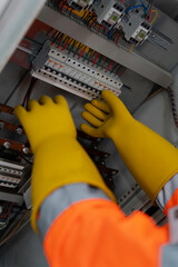 Technician working on electric panel