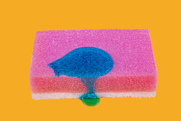 Detergent on the sponge. The detergent in the form of a gel flows on a sponge.