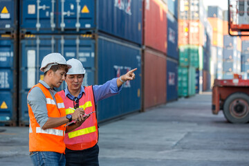 Foreman man working checking at Container cargo harbor to loading containers. Professional foreman...