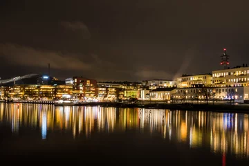 Foto op Plexiglas Stockholm, Sweden Dec 10, 2021 The skyline of Hammarby Sjostaden at nioght. © Alexander