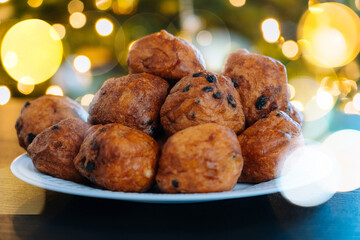 'Oliebollen', traditional Dutch pastry for New Year's Eve with sparkles. oil dumpling or fritter...