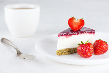 Piece of vegan cauliflower cake with strawberries. Sugar, gluten and lactose free.