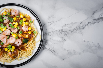 Healthy whole grain linguine with shrimps, asparagus, cherry tomatoes, fresh Parmesan cheese, and oregano.