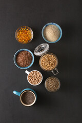 Source of vitamin E and nutrients in bowls on the table, copy space