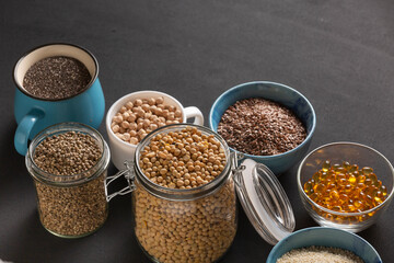 Source of vitamin E and nutrients in bowls on the table, copy space