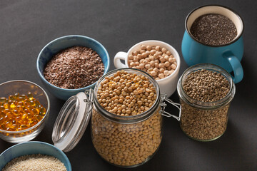 Source of vitamin E and nutrients in bowls on the table, copy space