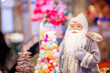 Christmas decorations in the interior. Festive background. New Year's room design, beautiful and shiny toys on the Christmas tree. Blurred background with copy space for text.