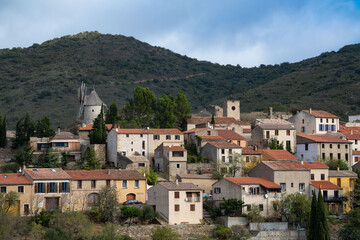 Fototapeta na wymiar Picturesque view of Cucugnan commune with main landmark 17th-century windmill, Aude department, southern France