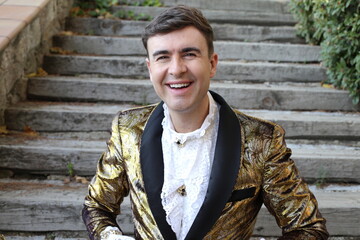 Gentleman showing opulence with golden outfit