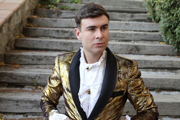 Gentleman showing opulence with golden outfit
