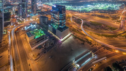 Fototapeta na wymiar Aerial view of media city and al barsha heights district area night timelapse from Dubai marina.