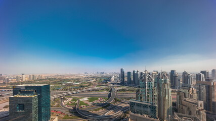 Obraz premium Dubai marina and JLT skyscrapers along Sheikh Zayed Road aerial timelapse.