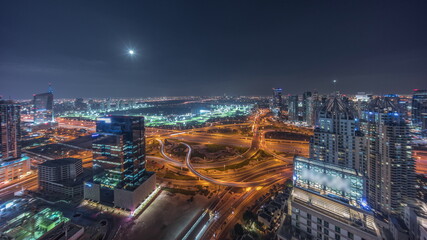 Fototapeta na wymiar Huge highway crossroad junction between JLT district and Dubai Marina night timelapse.
