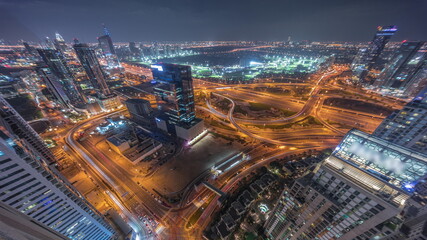 Huge highway crossroad junction between JLT district and Dubai Marina night timelapse.