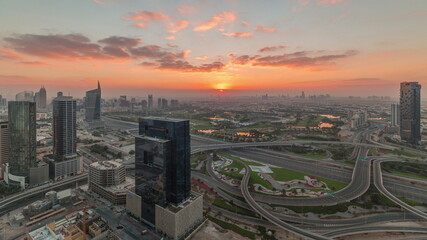 Naklejka na ściany i meble Sunrise over highway junction near media city and al barsha heights district area timelapse from Dubai marina.