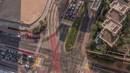 Aerial view of a road intersection between skyscrapers between skyscrapers timelapse.
