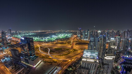 Fototapeta premium Huge highway crossroad junction between JLT district and Dubai Marina night timelapse.