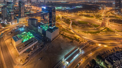 Fototapeta na wymiar Aerial view of media city and al barsha heights district area night to day timelapse from Dubai marina.