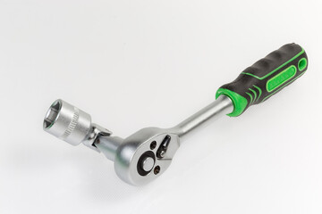 Ratchet wrench with inserted hexagonal socket via gimbal joint adapter - obrazy, fototapety, plakaty