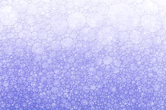 Macro close up of soap bubbles ,Water bubbles on blue and yellow background. Scientific image of cell membrane. Macro up of liquid substances. Abstract molecule atom sctructure. Macro shot of air or m