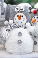 snowman in a gray hat , concept of the new year and the birth