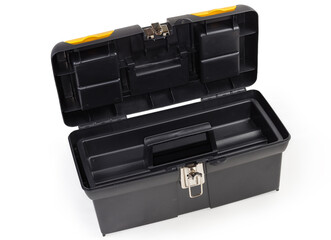 Open empty plastic portable multi-compartment toolbox on white background