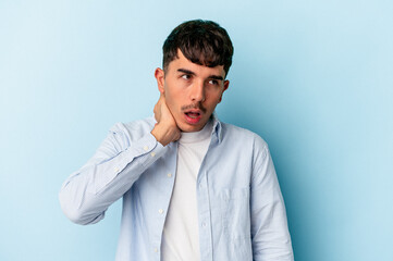 Young mixed race man isolated on blue background suffering neck pain due to sedentary lifestyle.