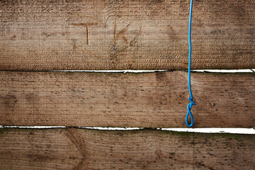 Love heart with initials t and k carved in horizontal wood panels.