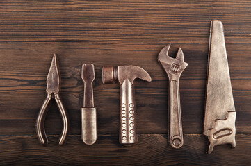 Handmade chocolate tools on wooden textured background close-up and copy space...