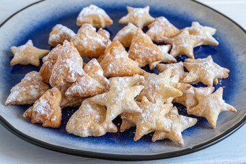 Christmas Cookies on blue plate.