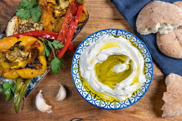 Grilled vegetables, hummus plate, pita bread. Mediterranean lunch ideas.