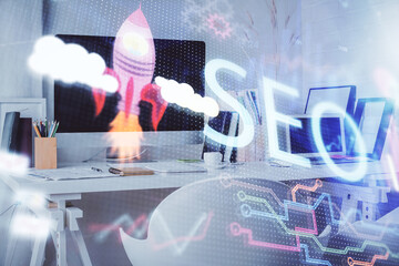 Double exposure of SEO drawing and office interior background. Concept of Search optimization...