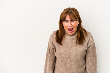 Middle age caucasian woman isolated on white background shouting very angry, rage concept,...
