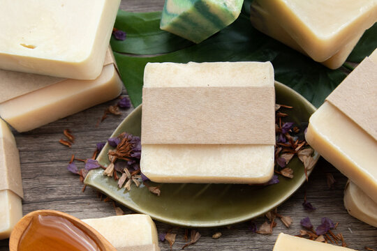 Mock up for small business homemade natural organic soap ,skin product mockup scene. Craft paper on cosmetic product ,natural aromatic spa treatment decoration on wooden vintage background