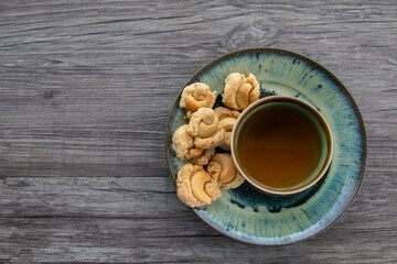 Tea and cookie on wooden vintage background, Top view of a Cup of Tea with Cookies, copy space.