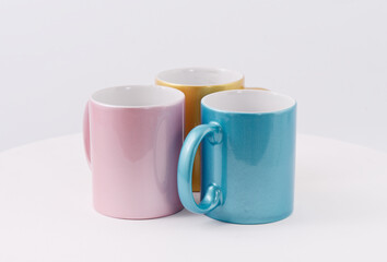 Colored cups for sublimation printing isolated on white background