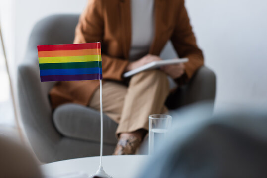 Cropped View Of Psychologist Near Small Lgbt Flag And Blurred Homosexual Patients