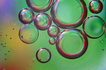 abstract background. drops of oil on water, different color. macro