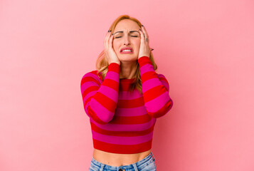 Young caucasian woman isolated on pink background whining and crying disconsolately.