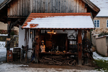 Prerov nad Labem, Czech Republic, 5 December 2021: Forged products, blacksmith shop, chains, Traditional historic country-style architecture in Skanzen, Polabi open-air ethnographic museum in winter